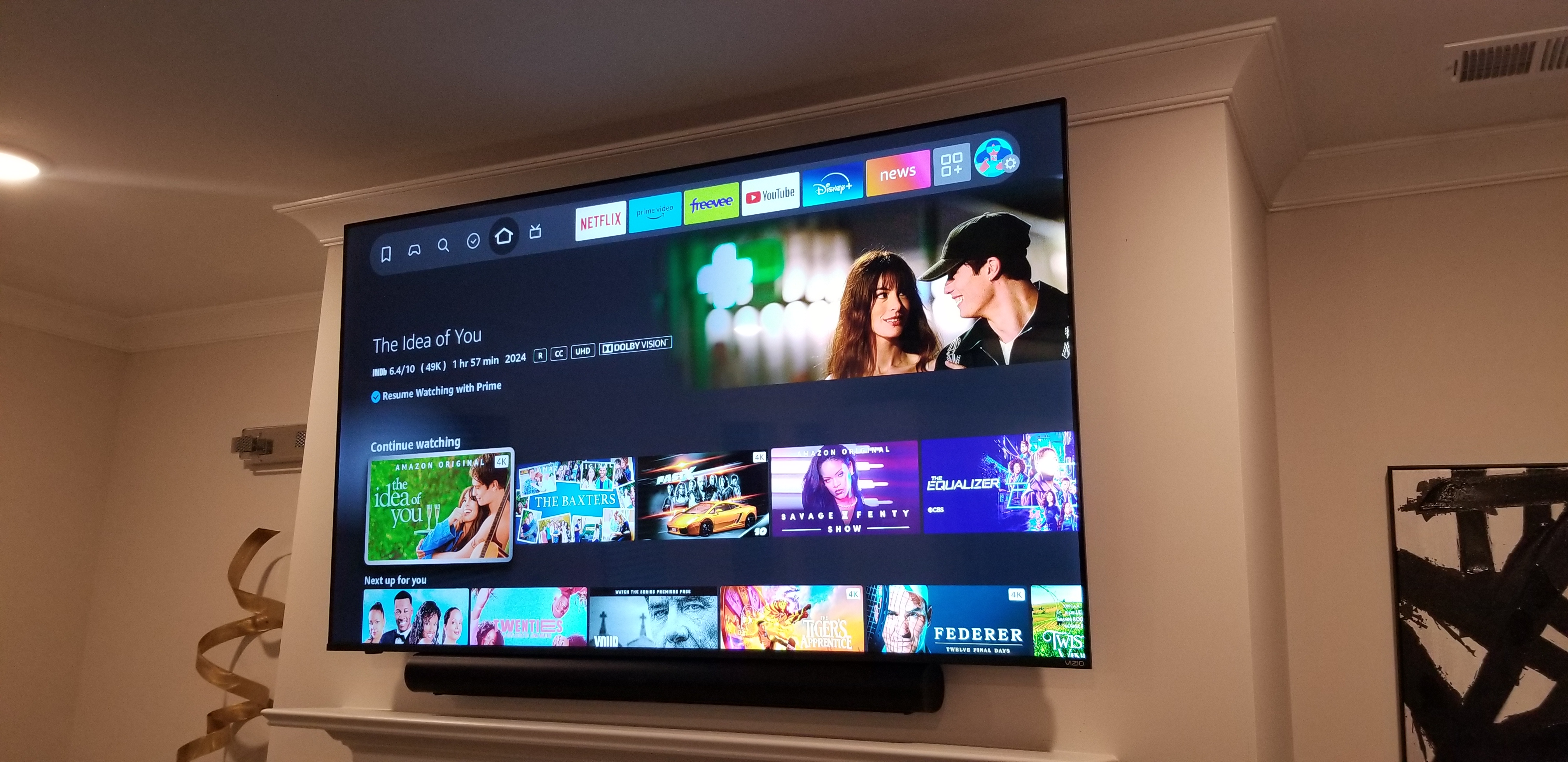 After — 68 inch TV professionally mounted over fireplace with soundbar by GOVNA Security Lilburn GA