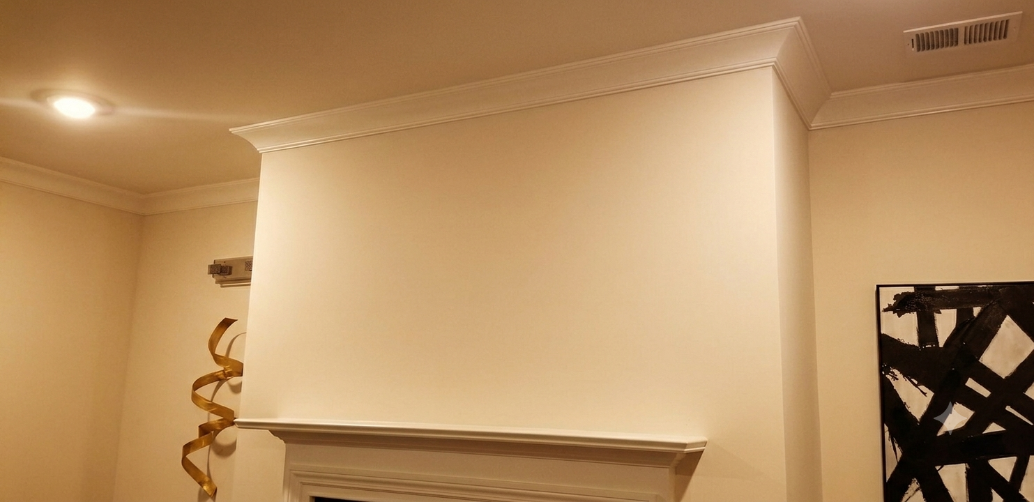 Before — blank wall above fireplace before TV mount installation by GOVNA Security Lilburn GA